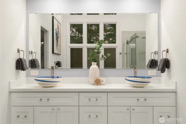 Dual sinks on the primary vanity with ample storage.
