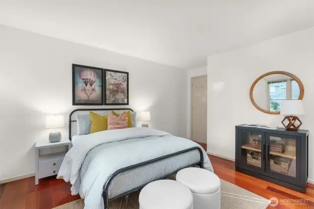 Secondary bedroom features new windows, closet and hardwoods.