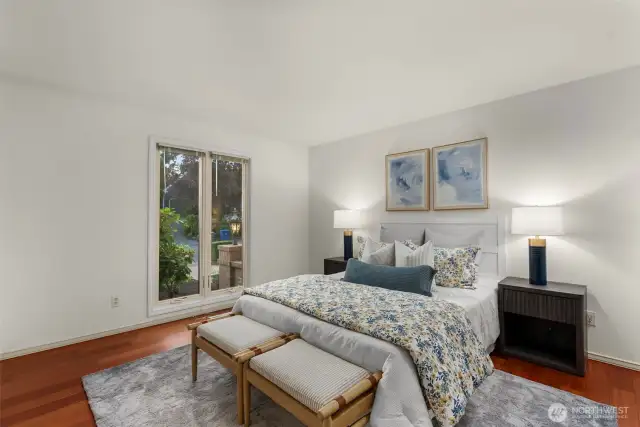 Secondary bedroom features new windows, closet and hardwoods