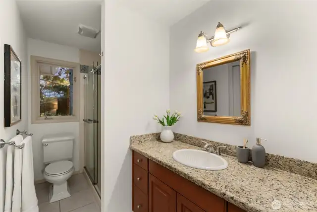 Secondary bath features a walk-in shower.