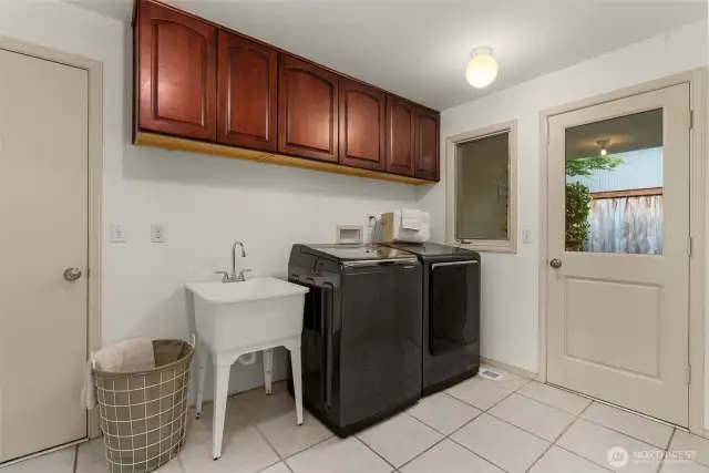 Laundry and mudroom with a separate exterior door connects to the garage and kitchen dining room.