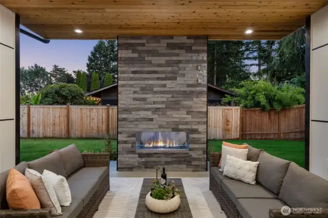 Covered outdoor living with gas fireplace and electric heaters