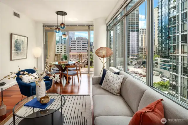 The livinOne of the many benefits of concrete and steel buildings is the floor to ceiling windows with wonderful natural light.g room let