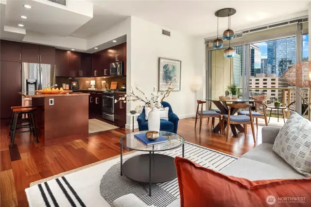 The main living and dining room are separate but open to the kitchen for great entertaining. The deck is just beyond the dining table.