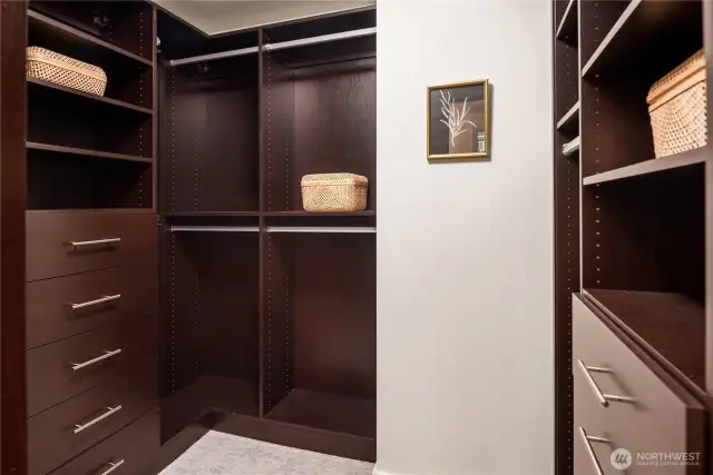 Enjoy custom California Closets in your primary bedroom closet.