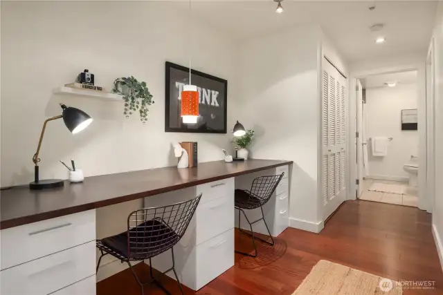 A large home office niche provides two great work spaces and designer lighting.