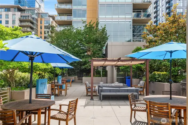 The outdoor plaza features multiple lounge areas perfect for entertaining.