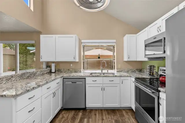 Great lighting in kitchen. Vaulted ceilings