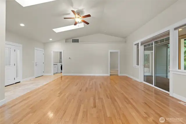 Large living room with vaulted ceilings and hardwood floors