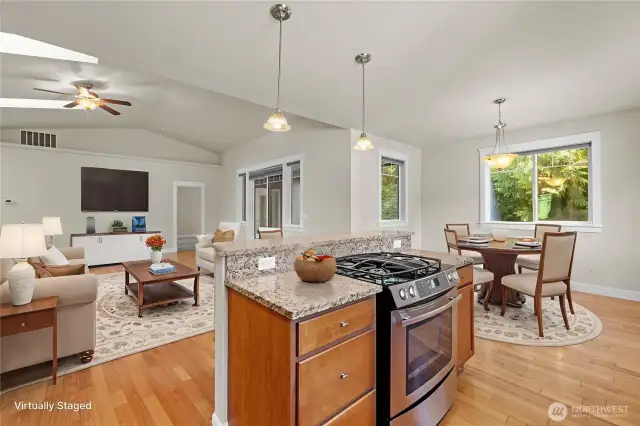 Virtually staged view looking toward the living room and primary bedroom