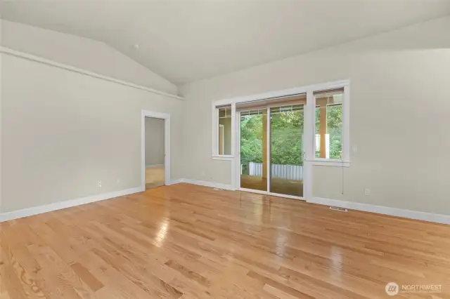 Primary bedroom and sliding door to the covered deck