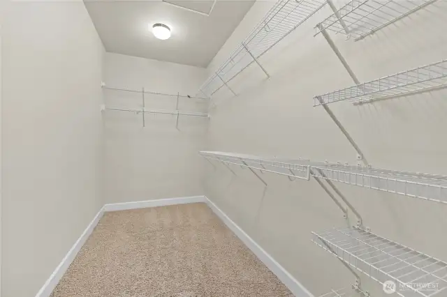 Primary bedroom walk in closet