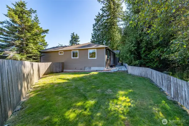 Fenced portion of the yard seen from the kitchen and dining room windows