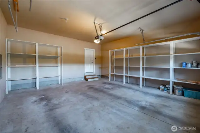 Two car garage with plenty of shelf storage
