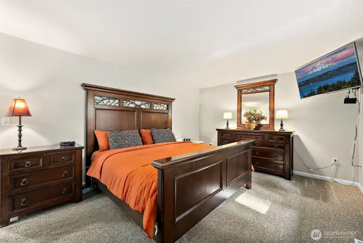 Spacious primary bedroom with walk-in closet and updated full bathroom.