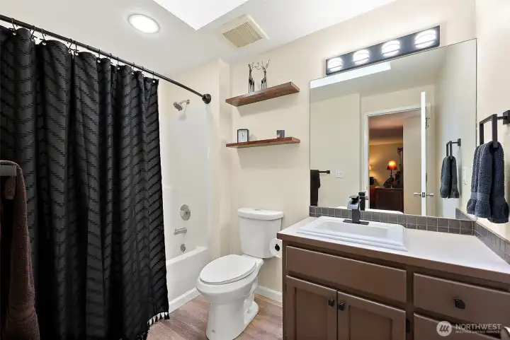 Updated full bath off the primary bedroom.