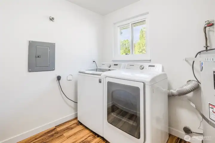 Large utility room with storage. Washer and Dryer inlcuded with Sale