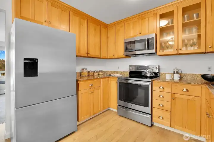 Beautiful Cook's Kitchen Shows Stainless Steel Appliances, Granite Counters & Exceptionally Attractive Shaker Style Cabinetry