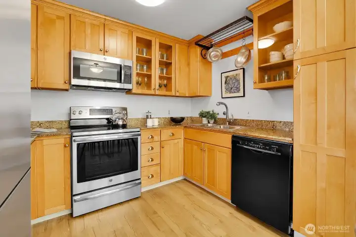 Beautiful Cook's Kitchen Shows Stainless Steel Appliances, Granite Counters & Exceptionally Attractive Shaker Style Cabinetry