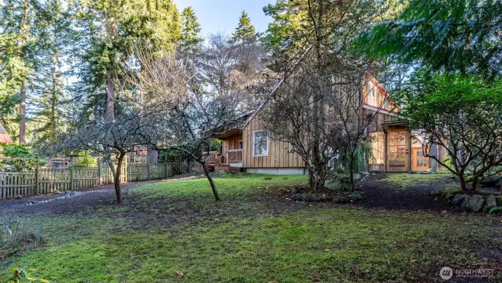 Main floor bedroom has a private deck facing the backyard.
