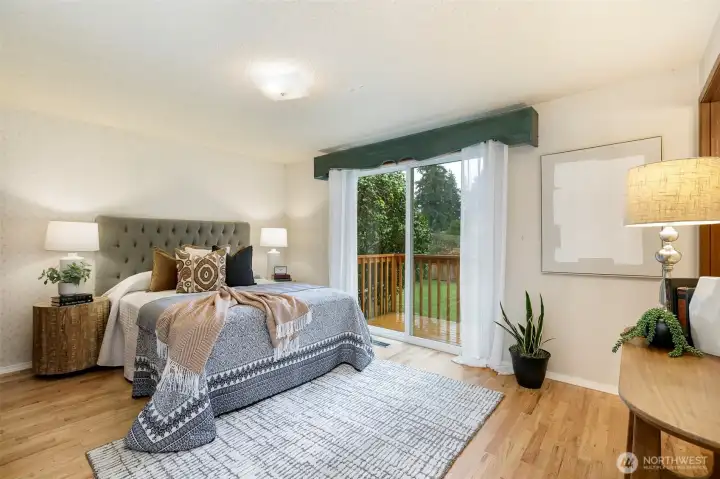 Primary bedroom with an ensuite full bathroom, the deck extends to the slider off the primary bedrm