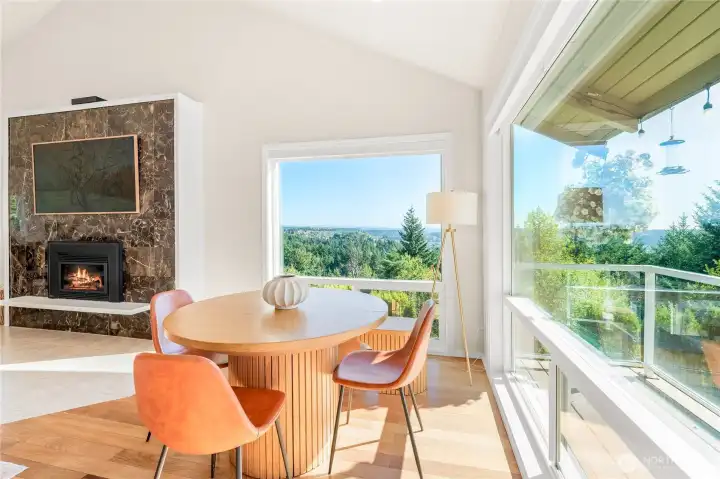 Dining area with gas fireplace and views of Sky Island and Sumner Valley