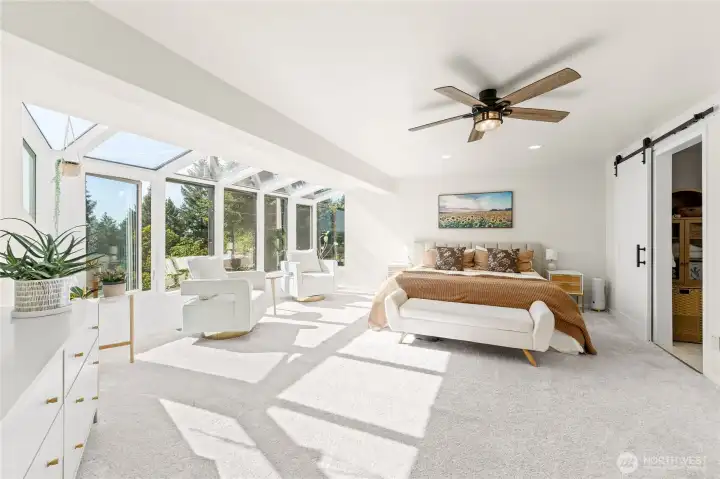 Primary bedroom with ceiling fan, sitting area and views of Sumner Valley