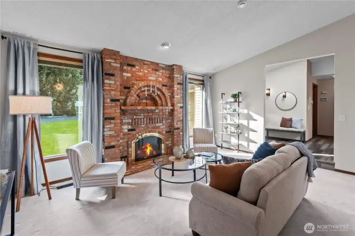 Living room with tall windows and gas fireplace