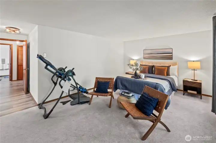 Super sized primary bedroom - french doors to sunroom and attached bath with walk in closet