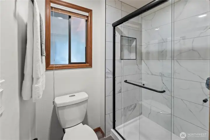 Brand new shower, fixture and flooring in primary bath