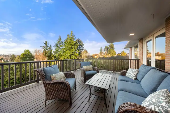Head out the glass doors from the dining room to the large deck- perfect for all summer gatherings!
