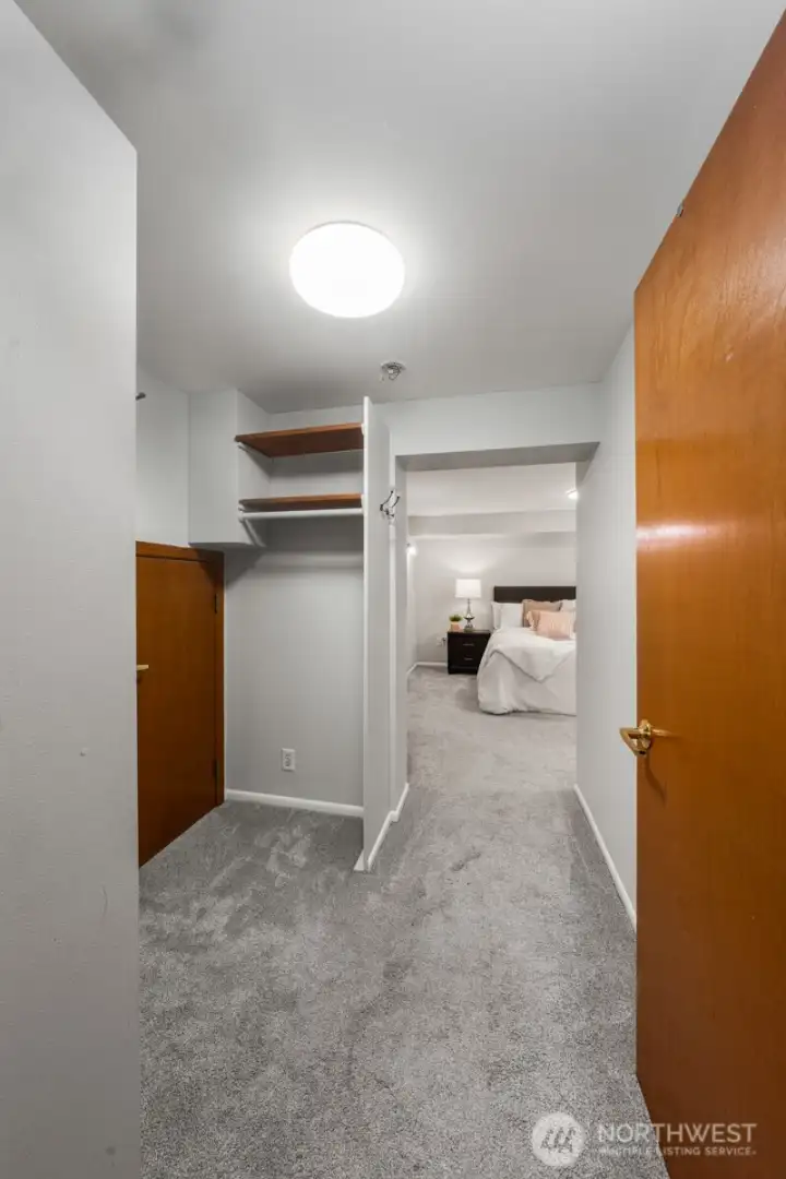 Heading into the downstairs bedroom w/ large closet on the left