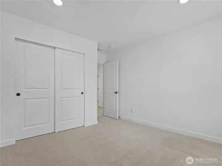 Bedroom #3 showing closet & entry.
