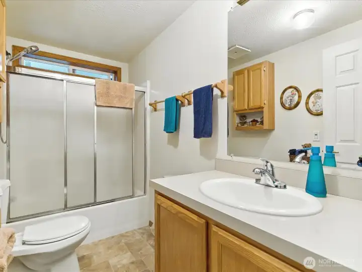 The second bathroom is conveniently located for guests, providing easy access and added comfort for everyday use or entertaining.