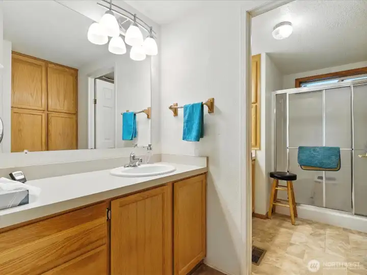 The primary bathroom includes a large linen closet, offering plenty of convenient storage for towels, linens, and everyday essentials.