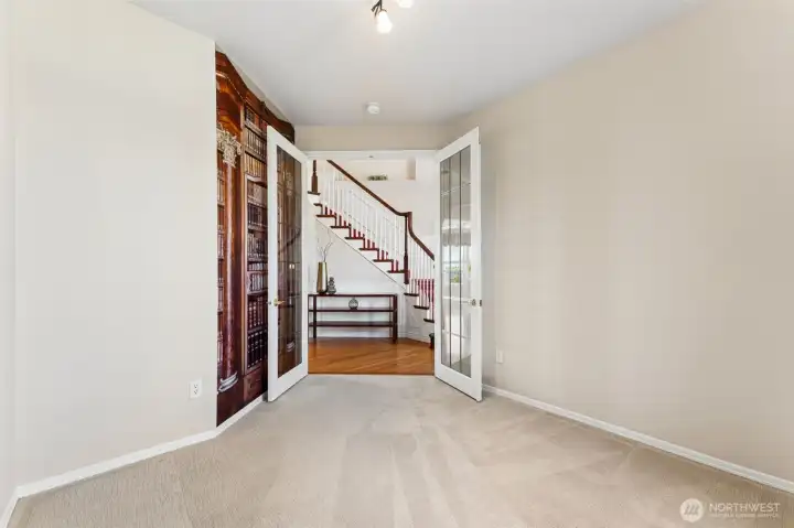 Main floor den with French doors, perfect for an office next to the entry
