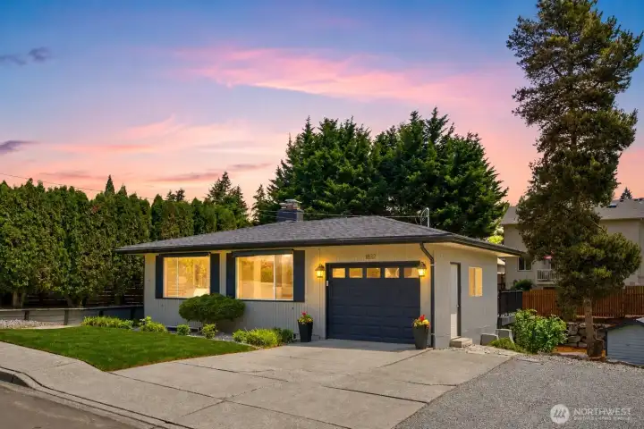 Beautiful twilight exterior showcasing warm lighting and inviting curb appeal in a desirable cul-de-sac setting Beautiful twilight exterior showcasing warm lighting and inviting curb appeal in a desirable cul-de-sac setting