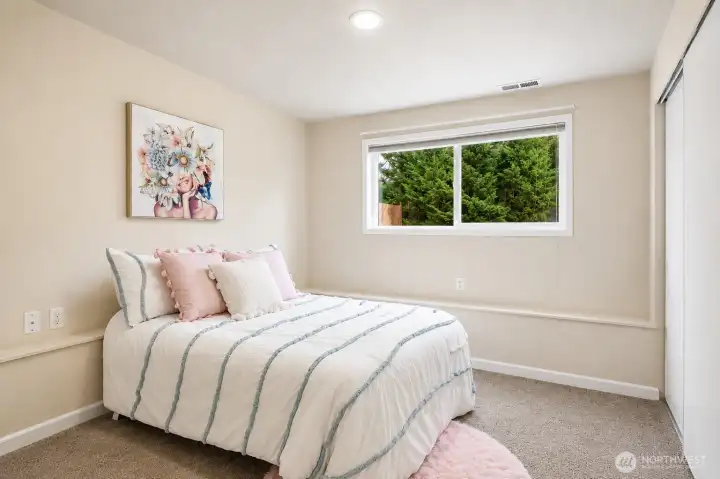 Bedroom 3 – Comfortable lower-level bedroom with natural light and closet space Bedroom 3 – Comfortable lower-level bedroom with natural light and closet space