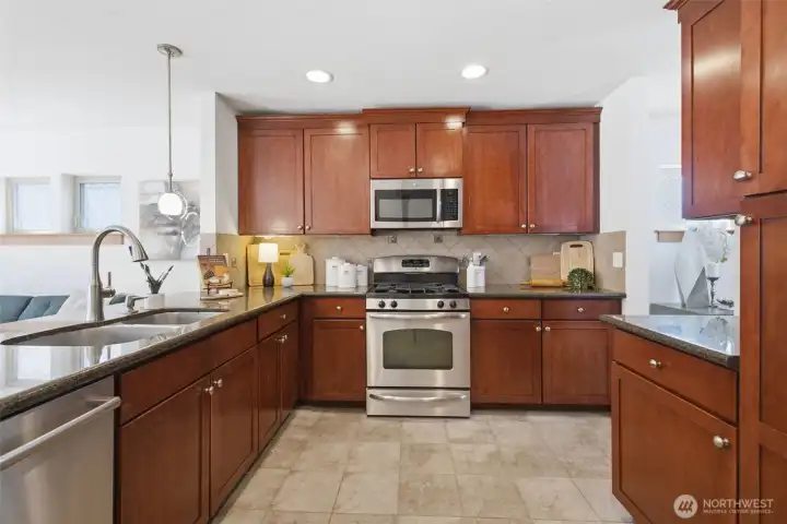 Plenty of counter space and storage in welcoming kitchen Plenty of counter space and storage in welcoming kitchen