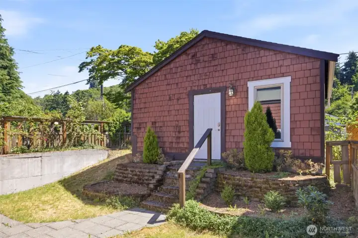 Double car garage accessible from back yard on one side, alley access from other side Double car garage accessible from back yard on one side, alley access from other side