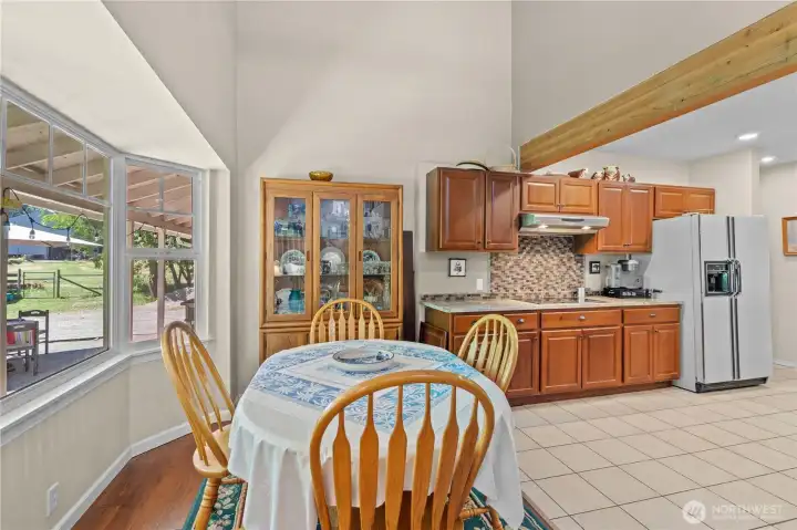 Dining Room and Kitchen. Dining Room w/Bay Window, High Ceilings and Hardwood Floors.