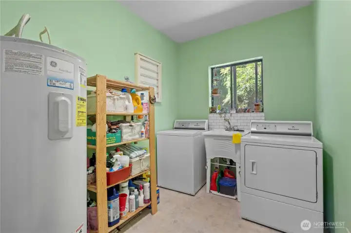 Laundry Room on the Main Floor w/New Hot Water Tank and Laundry Sink, as well! Very Spacious & Roomy!