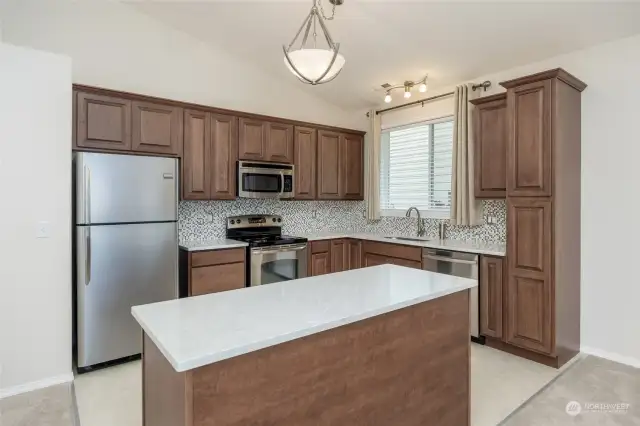 Kitchen features new cabinets, fixtures, Corian Counters. All appliances are included.