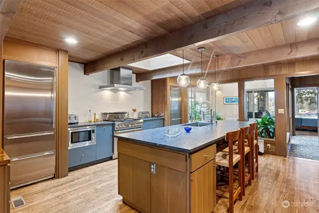 Spacious kitchen with leathered granite island.