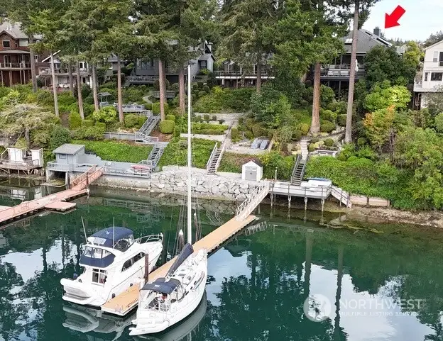 Shared deep water dock sits on the north property line and is shared with the   neighbor. An oversized deck at the waters edge. Lots of fun to be had in the sunshine. Launch your kayaks or take a dip in the water!