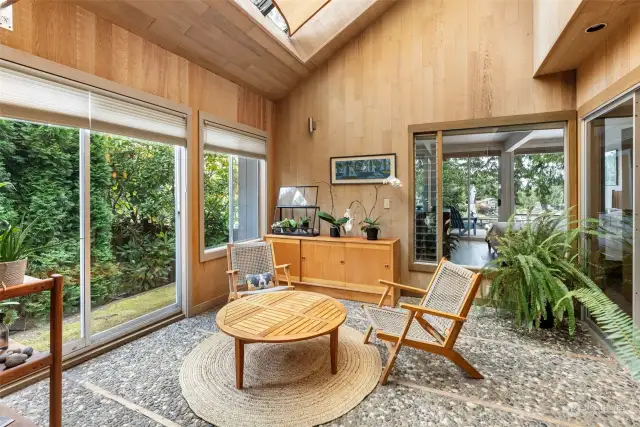 Sun room off of kitchen is light and bright.