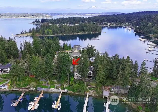 Deep-water docks are rare! The shared dock is on the north line and is shared with the neighbor to the north. Water and 110 power on the shore. Sellers have a sail boat and the neighbor has a 34 foot boat with a 3.5 ft draft. This home is perched on a peninsula that divides Honeymoon Bay from Echo Bay. These areas are known for protected deep-water moorage.