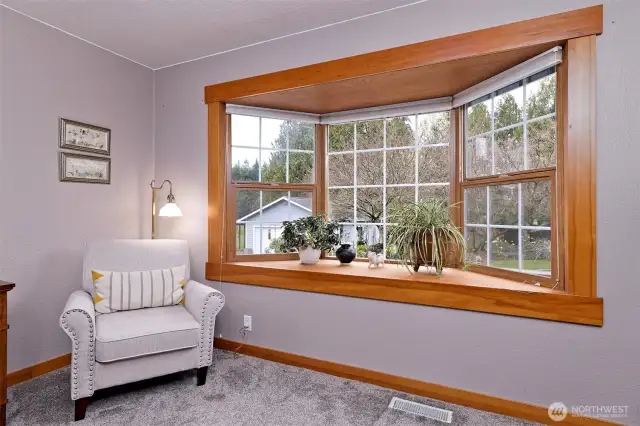 Primary bedroom with a cool bay window.