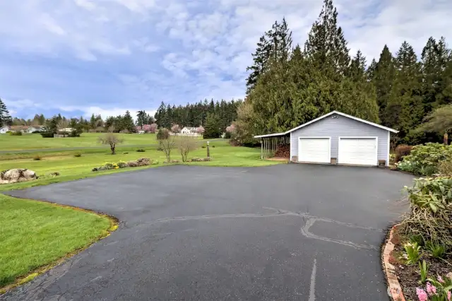 Nice paved driveway leading to the 2-car garage.