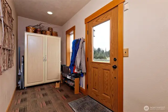 This is the side door near the garage. You enter into a "mud room" where you can hang your coat and drop your shoes, then step into the main living room.